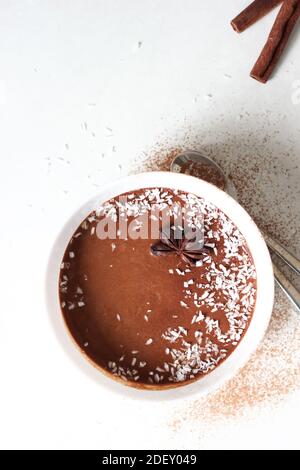 Chocolate Banana Mousse Bowl on White Background. Homemade Dessert. Stock Photo