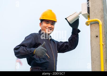CCTV maintenance technicians give confidence during work, After-sales service concept Stock Photo