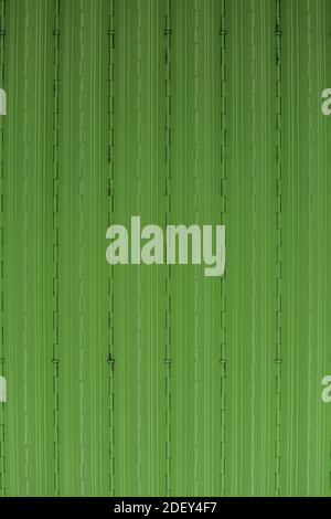 rolling door in bright green color. suitable for smartphone, personal computer, and tablet wallpapers Stock Photo