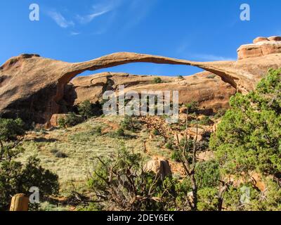 The delicate-looking Landscape Arch, the longest arch in the USA, photographed on a sunny day in Archers National Park, Utah Stock Photo