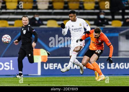 Kharkov, Ukraine. 01st Dec, 2020. Rodrygo Goes of Real Madrid (L) battles for the ball with Mykola Matviyenko of Shakhtar (R) during the UEFA Champion Stock Photo