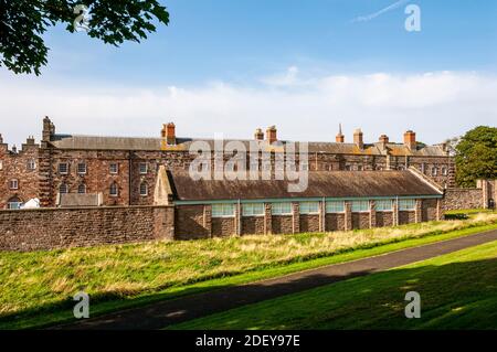 Three arched windows on a historic brick wall reflecting the ...