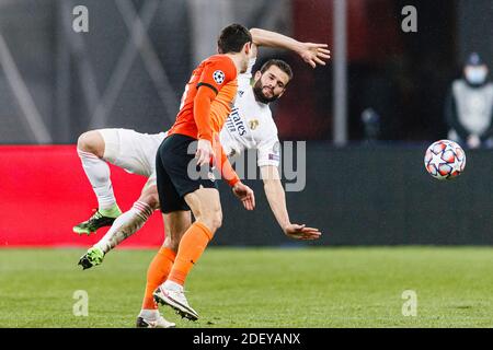 Kharkov, Ukraine. 01st Dec, 2020. Taras Stepanenko of Shakhtar (L) battles for the ball with Nacho Fernandez of Real Madrid (R) during the UEFA Champi Stock Photo