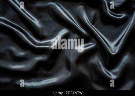 Wrinkle black satin cloth texture background Stock Photo