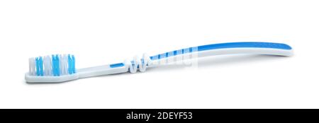 Plastic white toothbrush isolated on white. Stock Photo