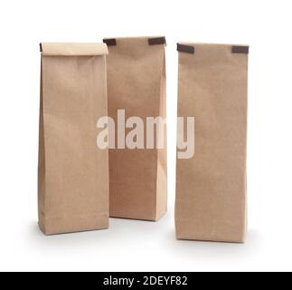 Group of paper craft disposable bags isolated on white. Stock Photo