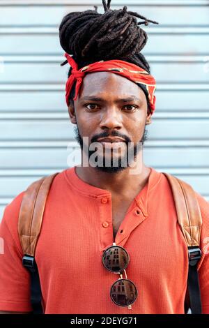 Stock photo of attractive and young african american boy smiling against blue background. Stock Photo