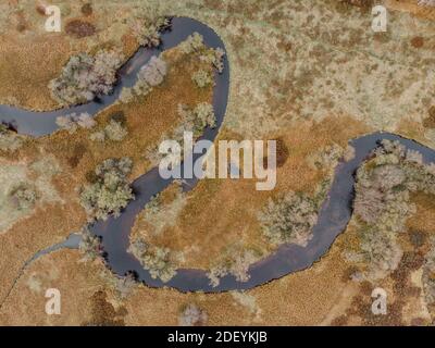 Aerial view of river stream.The river zigzags through the countryside.Meander of Vltava river,Czech republic.Colorful aerial landscape of river coast.