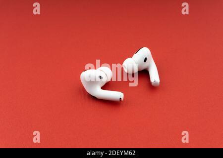 Kuala Lumpur, Malaysia - December 1,2020 : AirPods Pro on red background Stock Photo