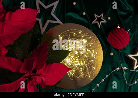 Flat lay christmas composition in trendy colors with defocused sparks. Magic concept with place for text. Stock Photo