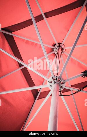 A close up of a red open parasol Stock Photo