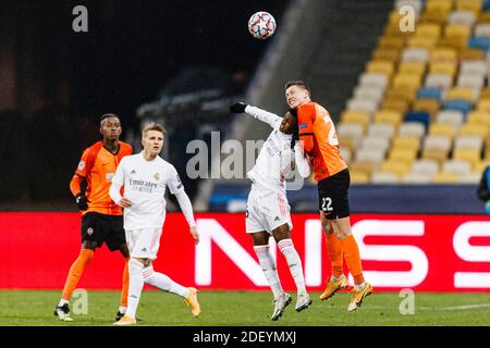 Kharkov, Ukraine. 01st Dec, 2020. Rodrygo Goes of Real Madrid (C) battles for the ball with Mykola Matviyenko of Shakhtar (R) during the UEFA Champion Stock Photo