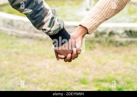 african couple in love holding hands Stock Photo