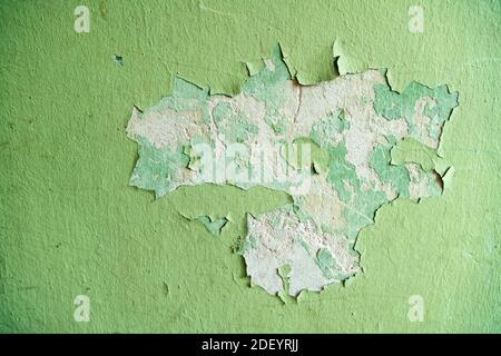 Close up of old stucco cracks on the wall. Weathered paint cracks on plaster. Cracked wall background. Abstract Web Banner Stock Photo