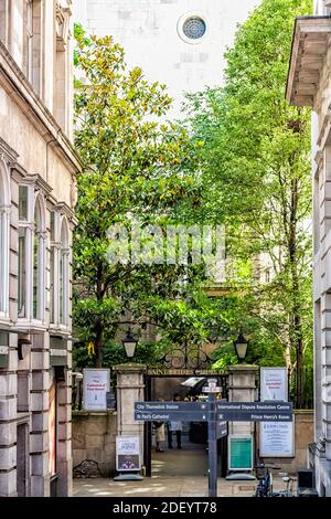 London, UK - June 22, 2018: Fleet street road in center of downtown city with St. Bride's church old architecture on Fleet street and sign for directi Stock Photo