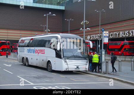 London, UK. 02nd Dec, 2020. A bus driver checks passenger tickets as they board bound for Stanstean Airport. Credit: SOPA Images Limited/Alamy Live News Stock Photo