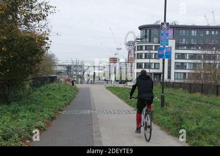 London, UK. 02nd Dec, 2020. A cyclist riding on the Greenway towards the Stratford High Street. Credit: SOPA Images Limited/Alamy Live News Stock Photo