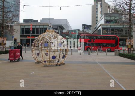 London, UK. 02nd Dec, 2020. A man pushing a cart walking around a Christmas decoration installation on Stratford street. Credit: SOPA Images Limited/Alamy Live News Stock Photo