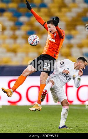 Kharkov, Ukraine. 01st Dec, 2020. Mykola Matviyenko of Shakhtar (L) fights for the ball with Lucas Vazquez of Real Madrid (R) during the UEFA Champion Stock Photo