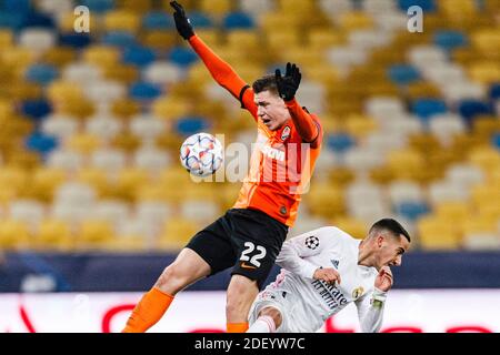 Kharkov, Ukraine. 01st Dec, 2020. Mykola Matviyenko of Shakhtar (L) fights for the ball with Lucas Vazquez of Real Madrid (R) during the UEFA Champion Stock Photo