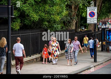 London, UK - June 23, 2018: Chelsea Bridge road street by Lister Hospital bus stop with people walking in summer by controlled zone no waiting traffic Stock Photo