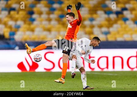 Kharkov, Ukraine. 01st Dec, 2020. Mykola Matviyenko of Shakhtar (L) fights for the ball with Lucas Vazquez of Real Madrid (R) during the UEFA Champion Stock Photo