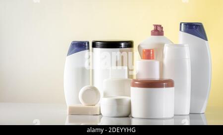 Banner Hair and body care cosmetics white bottles on white background Copy space selective focus Stock Photo