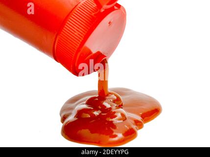 ketchup falling from bottle on white background Stock Photo