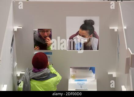 A student has an asymptomatic test using lateral flow antigen at a test centre at Edinburgh University ahead of being allowed to travel home for the Christmas holidays. Stock Photo
