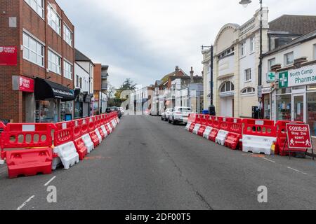 Temporary road alterations to allow social distancing for shoppers in UK town during the 2020 coronavirus covid-19 pandemic Stock Photo