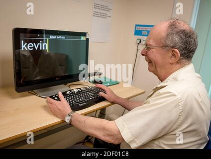 A man using a computer screen for visually impaired people Stock Photo