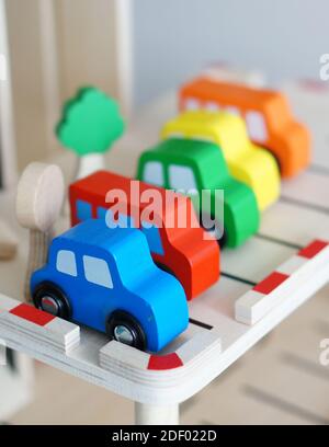 A row of colorful train wagon toys on a table Stock Photo