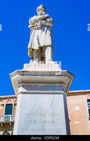 In the center of the Campo Santo Stefano square stands a statue dedicated to Italian linguist, writer, and patriot Niccolo Tommaseo. It was built in 1 Stock Photo