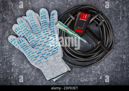 Electrician equipment on gray background top view, closeup Stock Photo