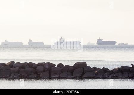 Cargo ships as seen in Manila Bay in the Philippines Stock Photo