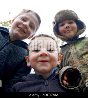 three boy brothers in the Autumn Stock Photo