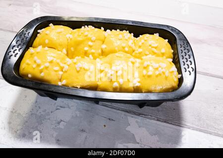 Brioche dough with butter and sugar in a silicone mold before going into the oven Stock Photo