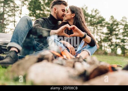 Happy young couple in love sitting on a park bench Stock Photo by  ©Vadymvdrobot 115363228