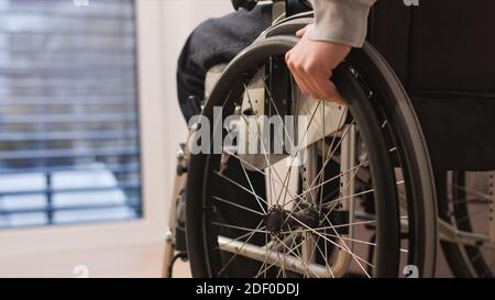 Close up of man on wheelchair at home in a living room. Stock Photo