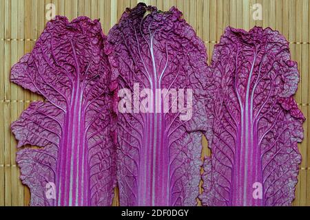 close-up topview of red chinese cabbage, against the background of a bamboo mat Stock Photo