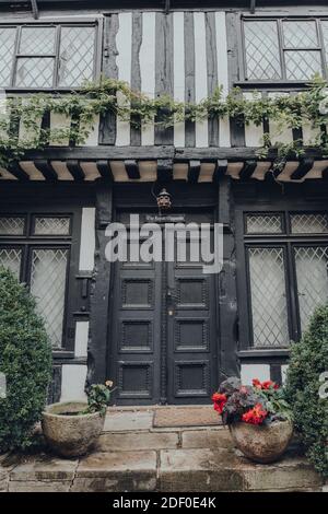 Rye, UK - October 10, 2020: Low angle view of an entrance to Tudor style The House Opposite on Mermaid street in Rye, one of the best-preserved mediev Stock Photo