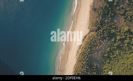 Top down of tropical paradise island landscape aerial. Amazing ocean bay coast with sand beach. Nobody tropic nature seascape of green jungle forest. Philippines resort at summer day Stock Photo