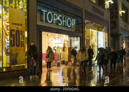 Topshop retail store on Oxford Street at night in the rain. London Stock Photo