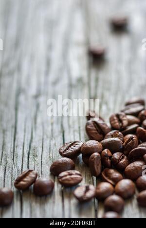 some coffee beans at old gray wood, vertical frame Stock Photo