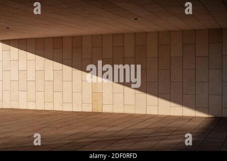 New modern ventilated stone wall made with different blocks of rectangular shape with wide joints Stock Photo