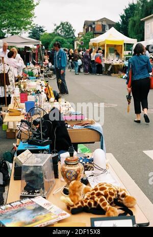 AJAXNETPHOTO.  LOUVECIENNES, FRANCE. - ATTIC CLEAROUT - STALLS LAID OUT ON THE VILLAGE STREETS FOR THE ANNUAL 'VIDE GRENIERS' PUBLIC SALE; THE VILLAGE WAS A LOCATION FREQUENTED BY 19TH CENTURY ARTISTS INCLUDING CAMILLE PISSARRO AND ALFRED SISLEY. RENOIR LIVED THERE FOR A WHILE.PHOTO:JONATHAN EASTLAND/AJAX REF:CD21544 26 Stock Photo