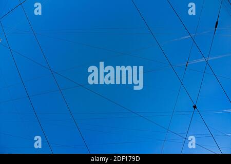 Wires in the blue sky, polluted city sky space and Cityscape, background Stock Photo