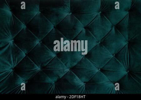 background malachite green teal velvet capitone textile, suede, velor, with buttons, sofa back. Close up photo Stock Photo