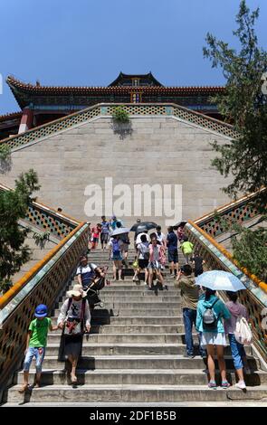 View of the steps up to Paiyundian with the Tower of Buddhist Incense, Foxiangge, behind, at the Summer Palace in Beijing, China, Stock Photo