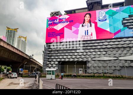 Huge colorful screens at the shopping center building in the metropolis of Bangkok in Thailand. Huai Khwang. Stock Photo